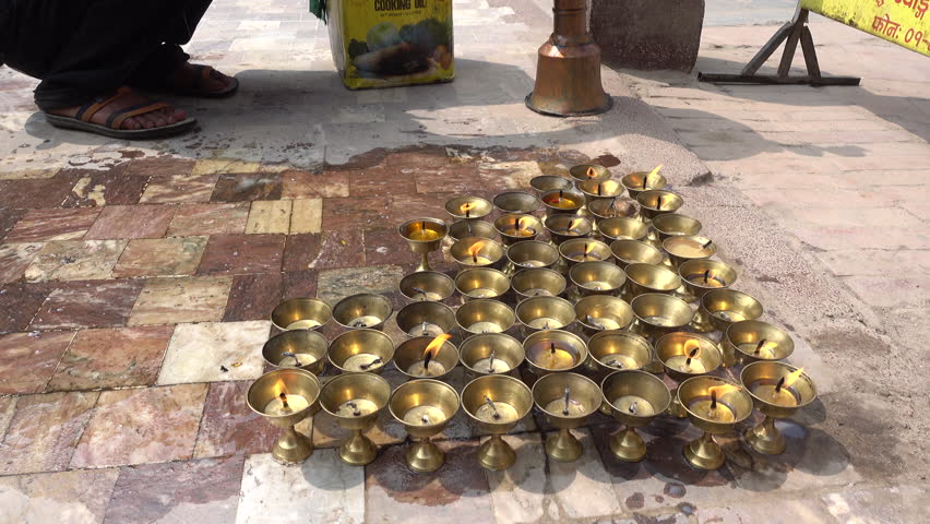 Candles burning in a Buddhist Temple at the ancient Swayambhunath complex, aka Monkey Temple, in Kathmandu, Nepal.