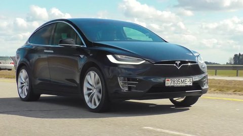 MINSK, BELARUS - APRIL 7, 2017: Tesla Model X P90D on a highway. Model X is the fastest and most capable SUV in history. It accelerates from zero to 60 miles per hour in 3.2 seconds. 