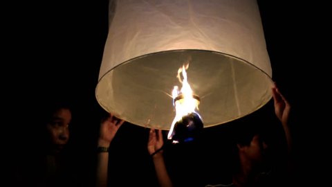 Thailand - Boys playing with a sky lantern Adlı Stok Video
