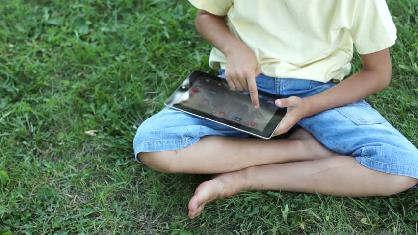 Boy playing with tablet computer
