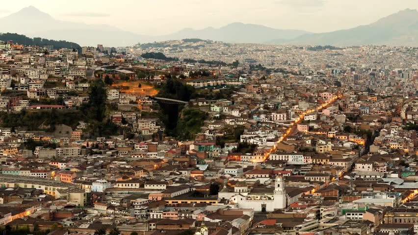 Camera takes a large turn over the Quito, capital of Ecuador, from the old town