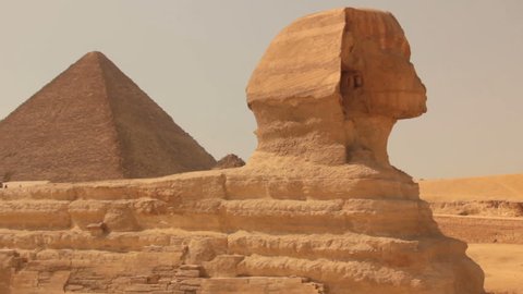 Observe Great Sphinx and pyramids in plateau of Giza