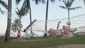 Happy little girl swinging in the hammock slow motion stock footage video