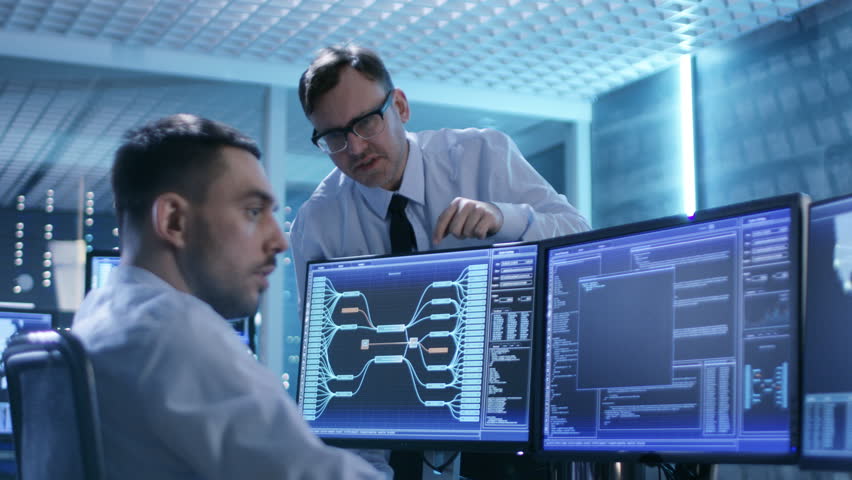 In the System Control Center Technical Support Team Gives Instructions with the Help of the Headsets. Shot on RED EPIC-W 8K Helium Cinema Camera. | Shutterstock HD Video #26262971