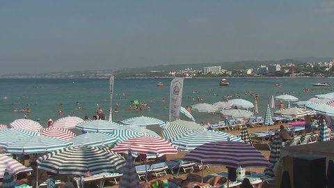 Turkey, Antalya, August 20, 2015 : beach, sun umbrellas,people swim and sunbathe on the beach