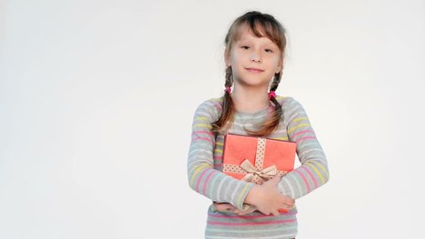 Little girl embracing red gift box, locked down real time video