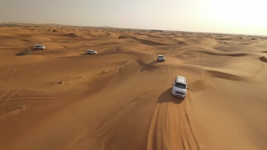 4K Aerial View Of Sports Cars Dune Bashing in Dubai Royalty-Free Stock Footage #26272103