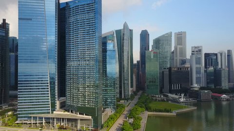 4k aerial footage of Singapore skyscrapers with City Skyline during cloudy summer day
