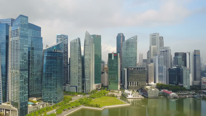 4k aerial footage of Singapore skyscrapers with City Skyline during cloudy summer day Royalty-Free Stock Footage #26274146