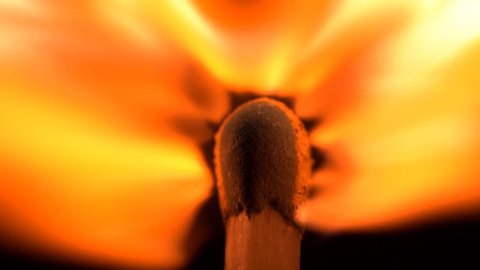 Match iginiting burning extreme macro close up background. A beautiful flame burns a match slowly. Macro extreme close up shot 