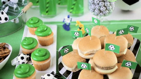 Kids football party set with snacks and drinks.