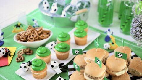 Kids football party set with snacks and drinks.