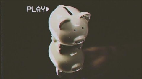 Fake VHS tape: inserting Euro coins into a piggybank (a porcelain container for money, a small bank in the shape of a pig, with a slot at the top).
