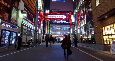 TOKYO, JAPAN - CIRCA MARCH, 2017: POV Walking in Kabuki-cho district of Shinjuku Ward. The area is a renown nightlife and red-light district. 