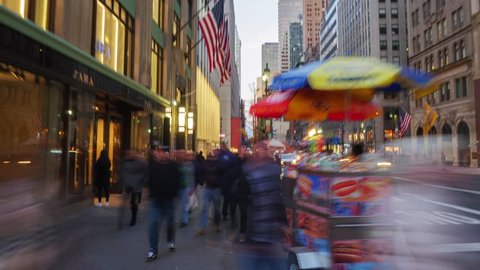 NEW YORK CITY - NOVEMBER 2016: Hyperlapse walk through crowd of people on Fifth Avenue from 42nd street till 47th Street at dusk time, after sunset in New York City, NY, USA