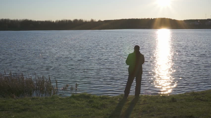 fisherman throws fishing tackles