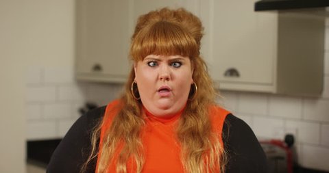 4k, Funny overweight woman pulling faces in slow motion.