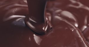 Slow motion of premium dark melted chocolate pour from above toned video, 4k 60fps prores footage