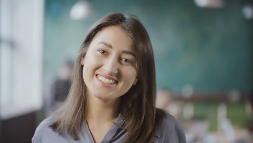 Portrait of young successful female employee. Asian woman entrepreneur worker in busy office, looks at camera, smile. | Shutterstock HD Video #26335841