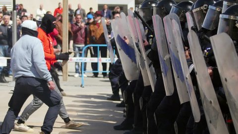 TULCEA, ROMANIA - APRIL 28: Protesters clash with riot gendarmerie during a riot-control exercise on April 28, 2017 in Tulcea, Romania