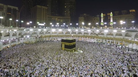 Mecca, Saudi Arabia - September 15, 2016: Time lapse video of Muslim pilgrims circling around the holy Kaaba at night during Hajj inside al Masjid al Haram in Mecca, Saudi Arabia. Camera zoomin in.