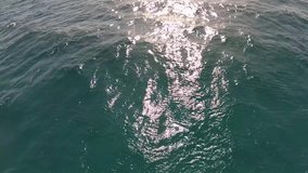 Beautiful blue sea water surface shot from sailing motor boat. Sea landscape view from of moving yacht. Real time full hd video footage shot with action camera.