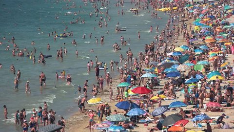 16.08.2016 - Odessa, Ukraine. Crowded sunny beach. Many people at seaside. Nice vacation spot.