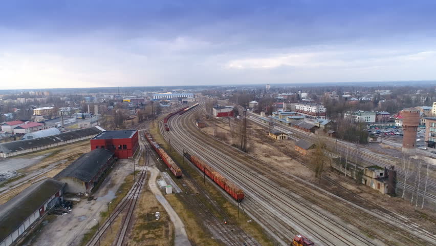 The aerial view of the train railtracks inside a factory with all the buildings in Tartu Estonia