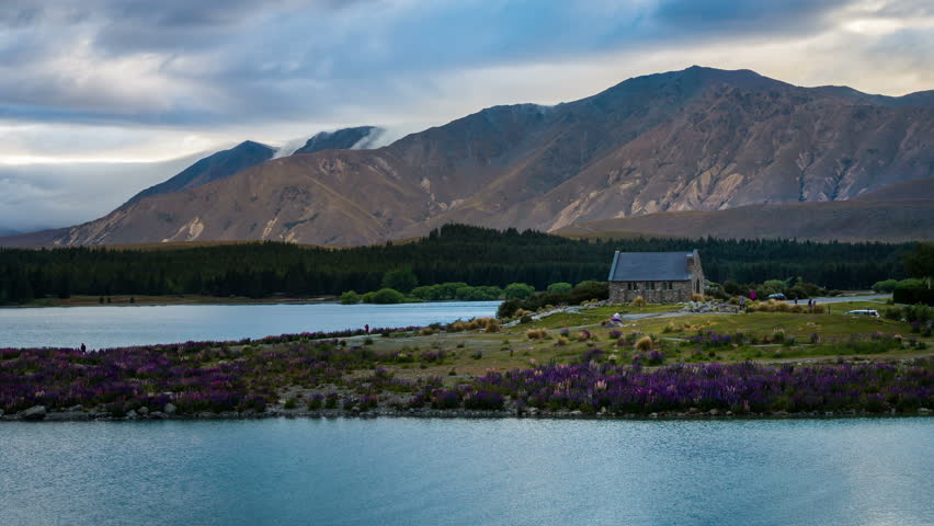 Lake Tekapo and Church of The Good Shepherd, New Zealand in Time Lapse in Summer. New Zealand Landscape, Mountains and Nature.