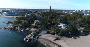 Hanko city, Cinema 4k aerial rising view of the city, towards ita- and lansi-satama, on a sunny spring day, in Hango, Finland