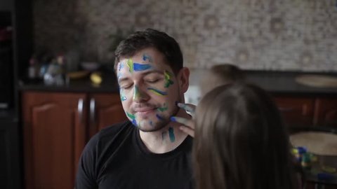 Two Daughters Draw at The Daddy on The Face, in the Kitchen