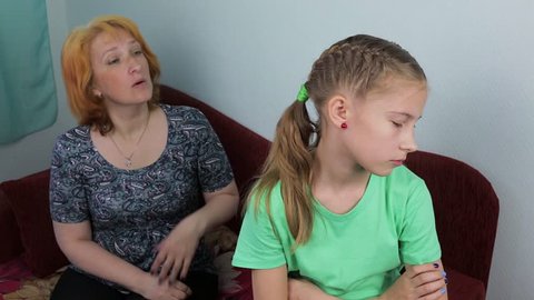 Upset mother scolds her daughter
