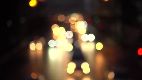 4K Bokeh of car lights. On the street at night Colorful Circles Video Background Loop Glassy circular shapes perform a colorful dance. motion background that is just perfectly suited for DVDs events
