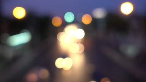 4K Bokeh of car lights. On the street at night Colorful Circles Video Background Loop Glassy circular shapes perform a colorful dance. motion background that is just perfectly suited for DVDs events