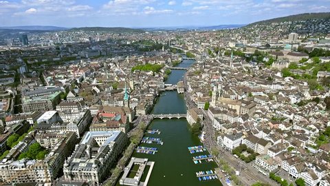 Flying over the City of Zurich in Switzerland Aerial Shot in 4K Ultra HD feat. Limmat River, Bridges and Famous Landmarks