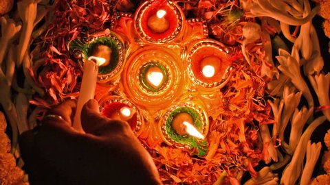 Deepabali , Deepavali or Deepawali - the festival of lights, is widely celebrated in India and now all over the world. Rangoli Diyas - colourfula and decorated candles are lit in night .