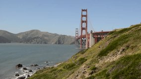 The Golden Gate Bridge HD video, an engineering marvel of construction and architectural landmark which sees both automobile and pedestrian traffic in San Francisco, California, USA