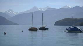 Boats floating on lake Thun Bernese Oberland Switzerland
