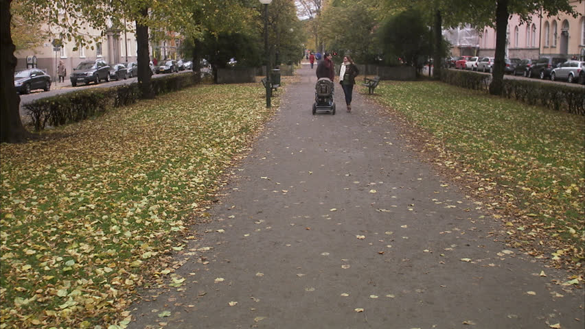 A happy family walking in a park