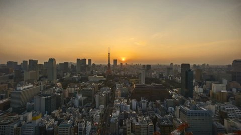 4k time lapse of night to day sunrise scene at Tokyo city skyline with Tokyo Tower. Zoom in