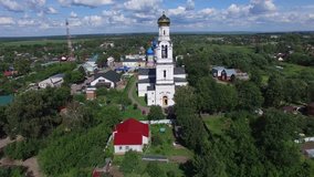 Aerial drone video of ancient church in Dmitrov area in the afternoon, Rogachevo village, located in Moscow Oblast 100 km north of Moscow, the capital of Russia