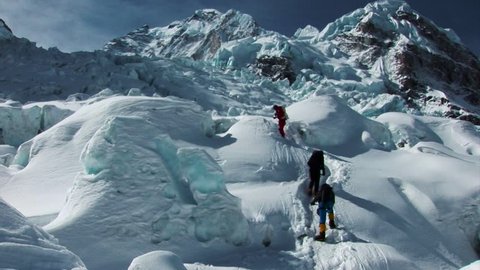 Hikers and sherpas climb/trek their way to the summit of Mount Everest, Himalayas, Nepal.  