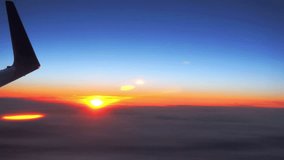 Beautiful video footage of a airplane wing against the sunset, HD 1080p