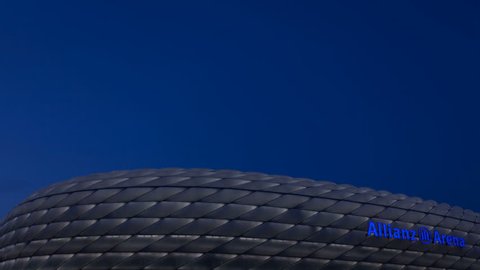 MUNICH, GERMANY - MAY 23, 2013: Twilight to night 4K timelapse zoom-out of the Allianz-Arena Soccer Stadium in Bavaria