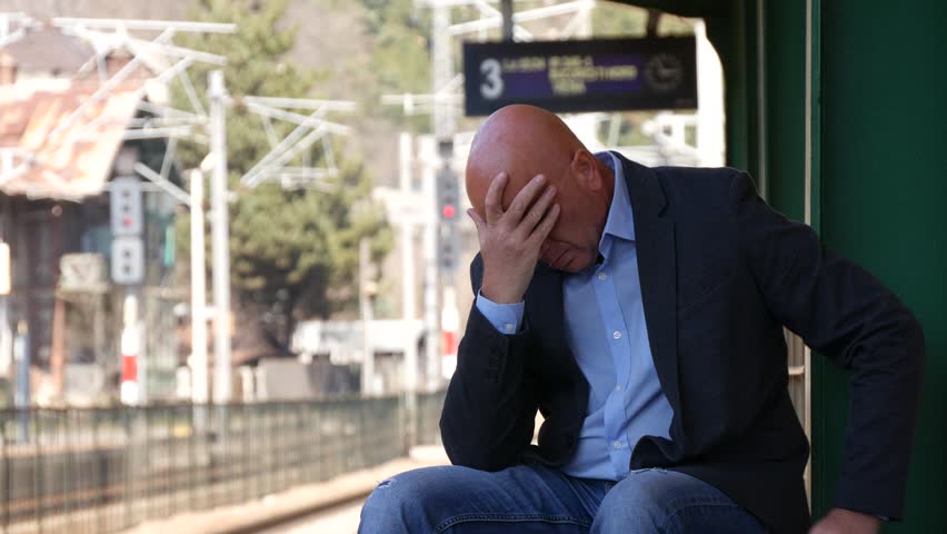 Depressed Man Stay Sad Looking Concerned Wait Train Troubled and Disappointed (Ultra High Definition, UltraHD, Ultra HD, UHD, 4K, 3840x2160) Royalty-Free Stock Footage #26446136