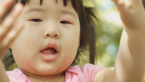 Beautiful Baby East Asian Girl on Sunny Day