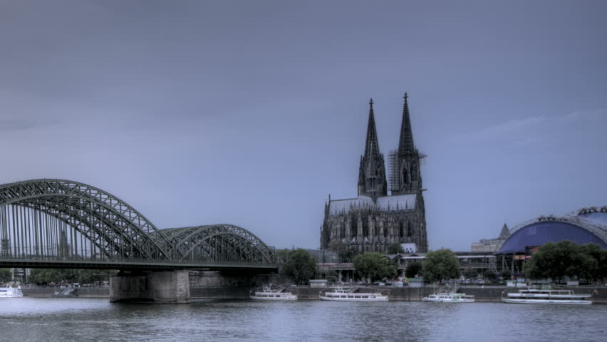 HDR Time lapse Riverside view of the Cologne Cathedral and railway bridge over