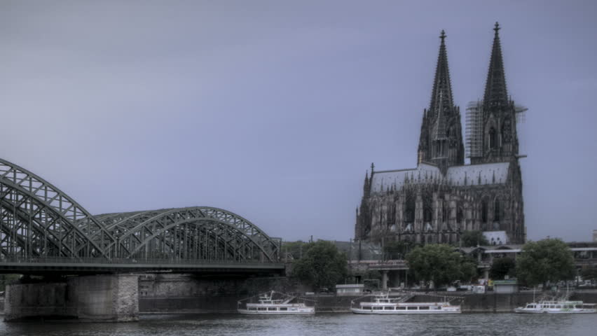 HDR Time lapse Riverside view of the Cologne Cathedral and railway bridge over
