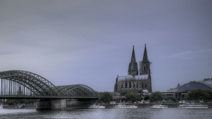 HDR Time lapse Riverside view of the Cologne Cathedral and railway bridge over