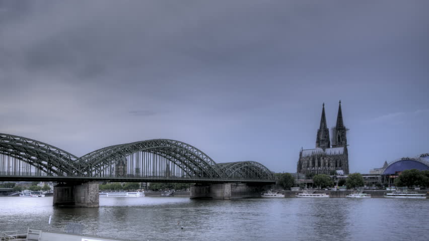 HDR Time lapse Riverside view of the Cologne Cathedral and railway bridge over